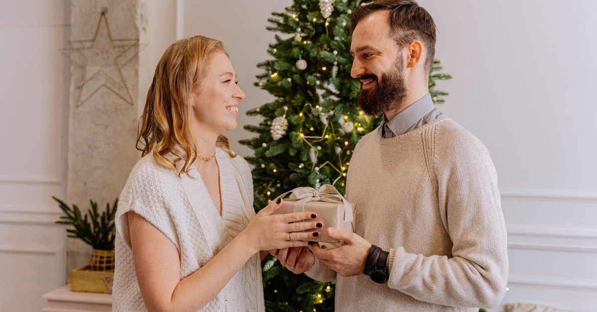 couple exchanging presents on christmas